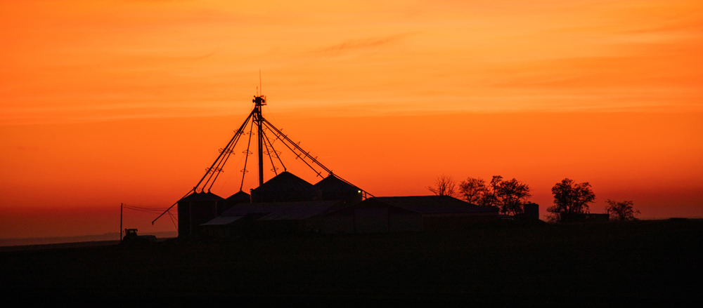 Sunset over a farm